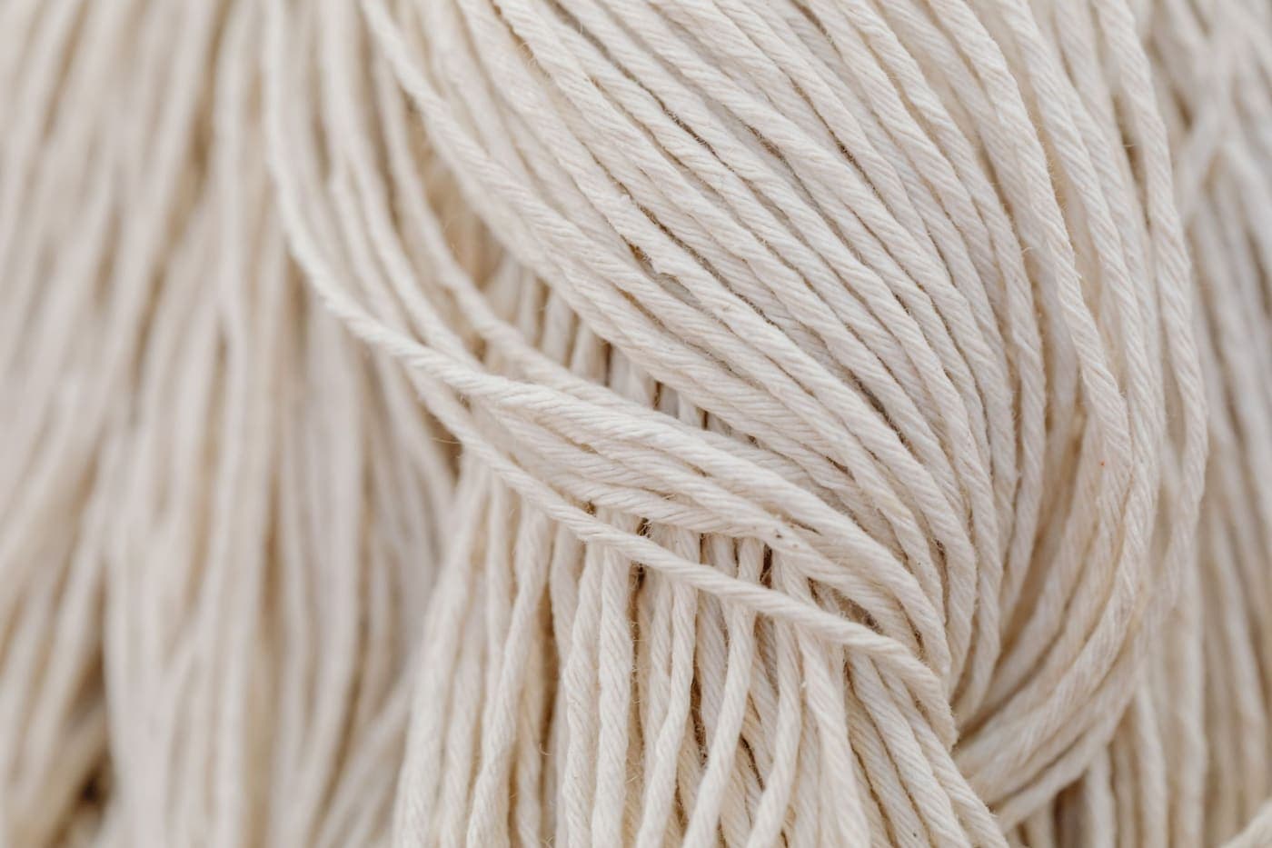Close-up of white cotton yarn in a loose tangled arrangement