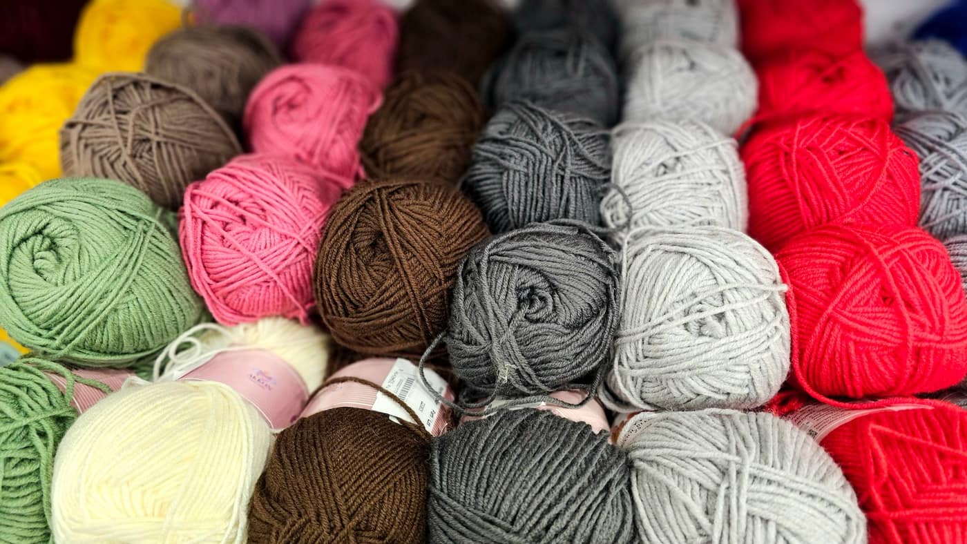An array of colorful yarn balls arranged together