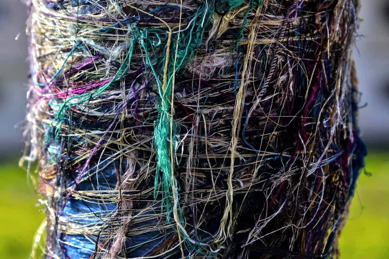 Close-up of tangled yarn and loose thread ends