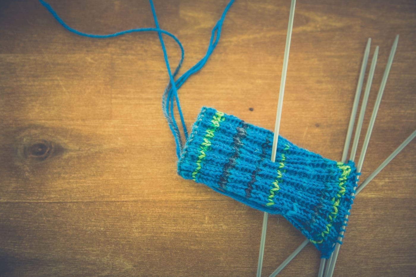 A sock in progress on fine circular needles with fingering weight yarn