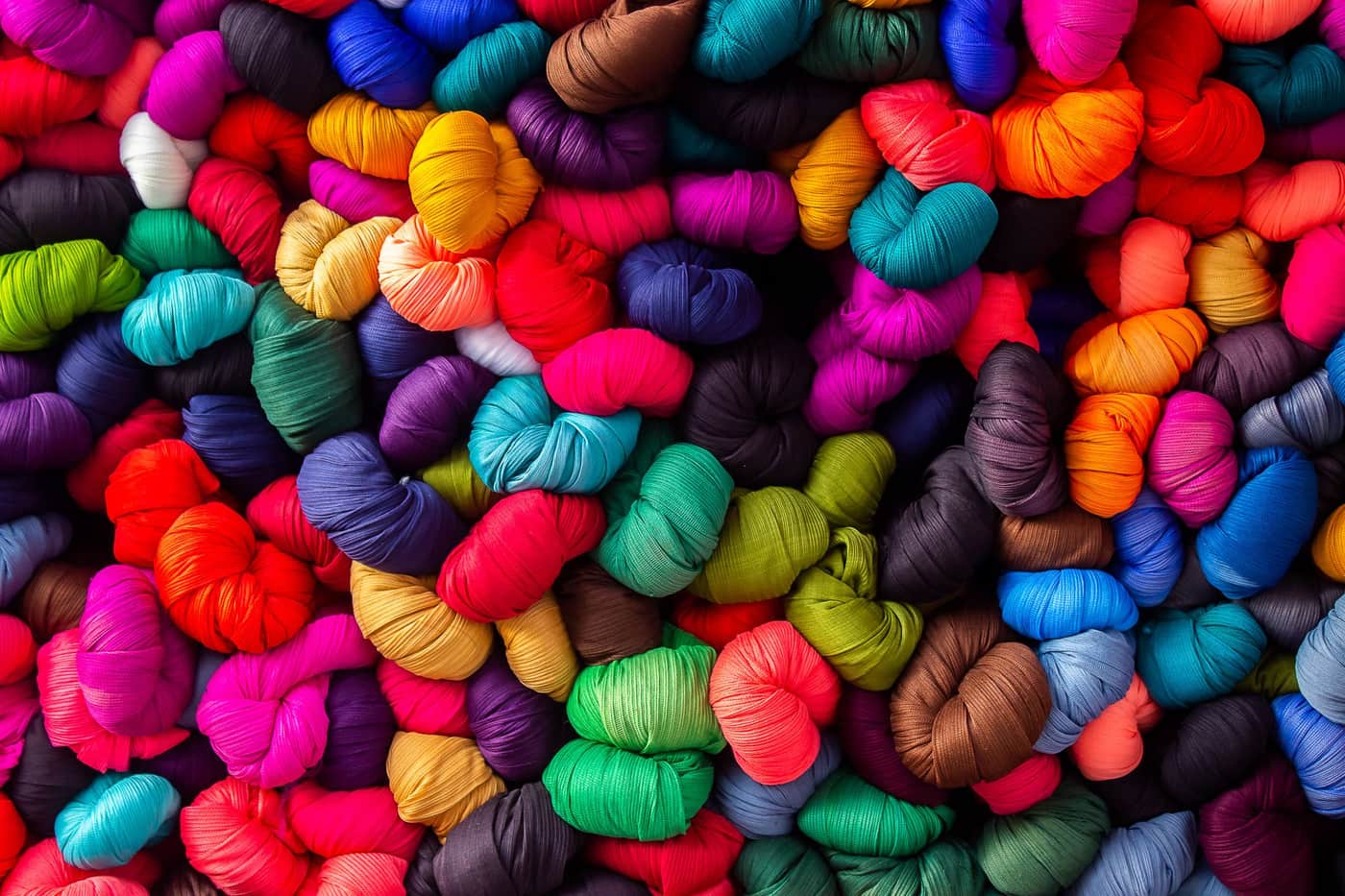 A vibrant assortment of colorful yarn skeins
