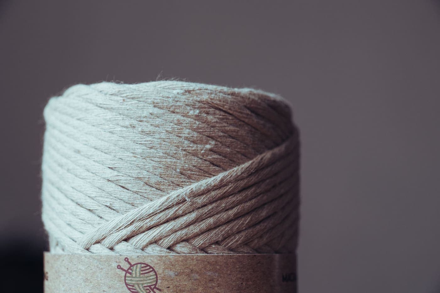 Close-up of a spool of beige yarn